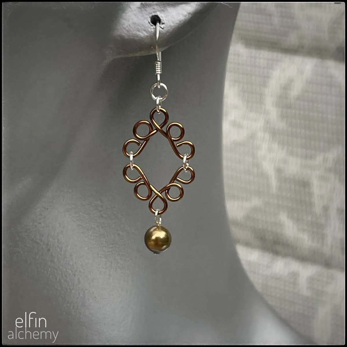 scroll style earrings with Swarovski pearl