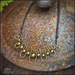 Squiggle Necklace With Bronze Swarovski Crystal Pearls by Sam Rowena